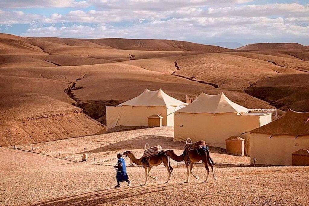 Agafay Desert luxury camp with camels Morocco